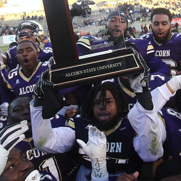 Alcorn State players hoist SWAC East trophy