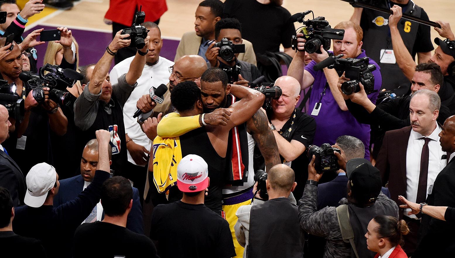 LeBron James and Dwayne Wade hug after game