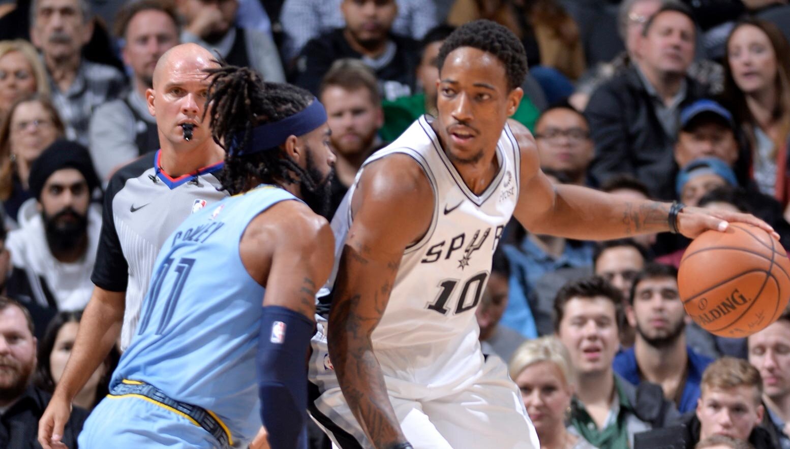 Demar DeRozan takes on Mike Conley