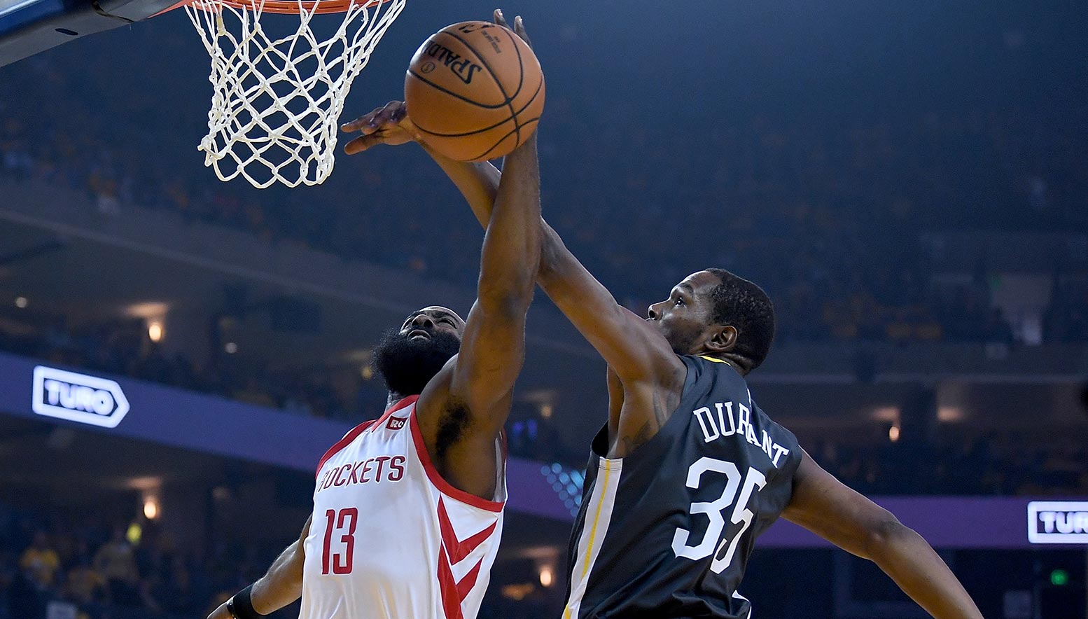 Kevin Durant contests the shot of James Harden
