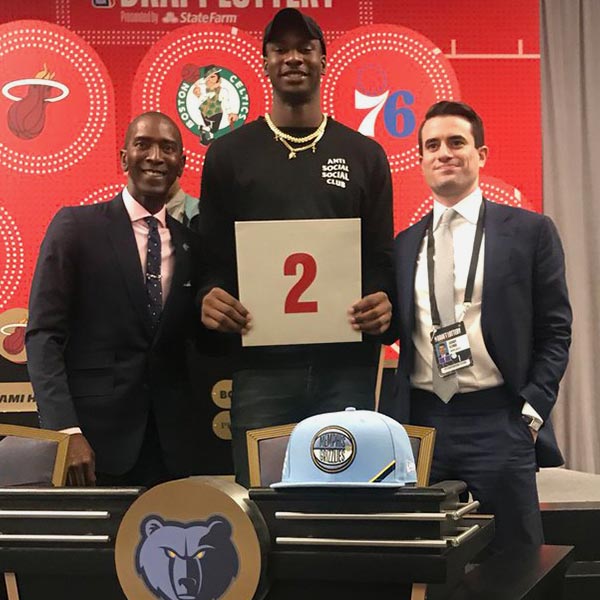 Elliot Perry, Jaren Jackson Jr., and Zach Kleiman pose for a photo after receiving the second round pick in the NBA Draft Lottery