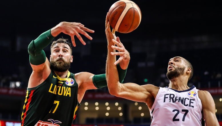 Jonas Valanciunas defending against France Jonas Valanciunas defending against France