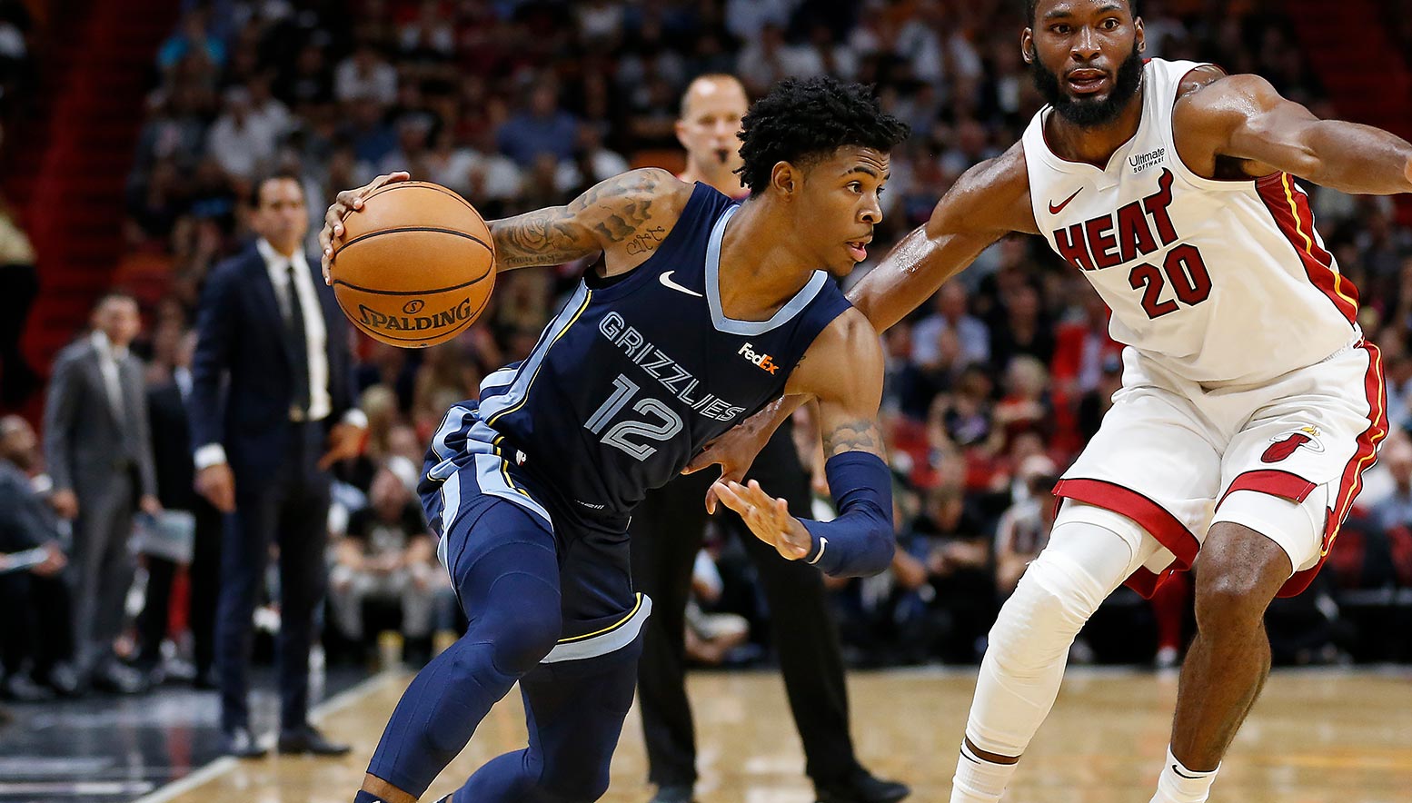 Ja Morant #12 of the Memphis Grizzlies drives to the basket against Justise Winslow #20 of the Miami Heat
