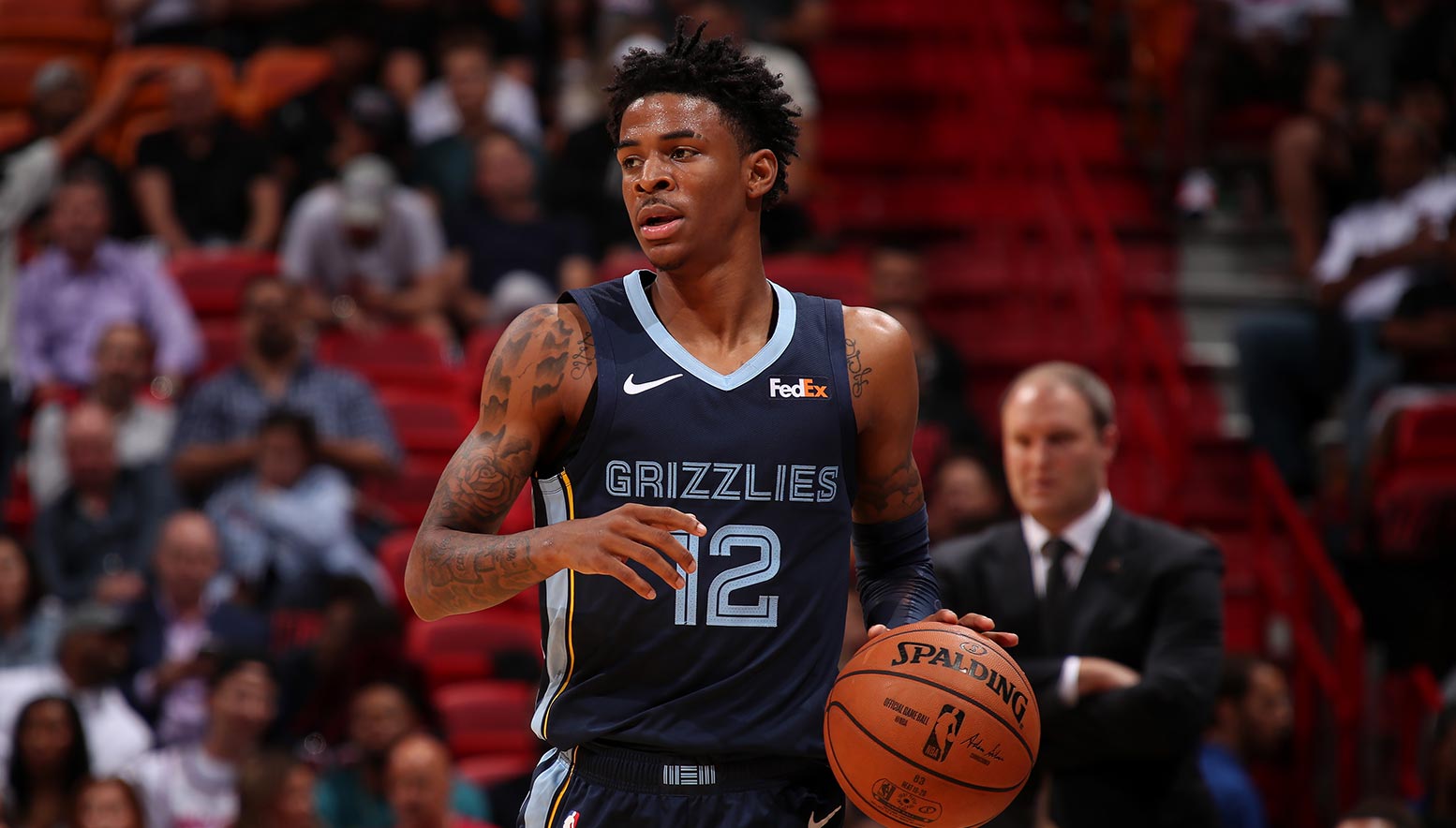 Ja Morant #12 of the Memphis Grizzlies handles the ball against the Miami Heat at American Airlines Arena