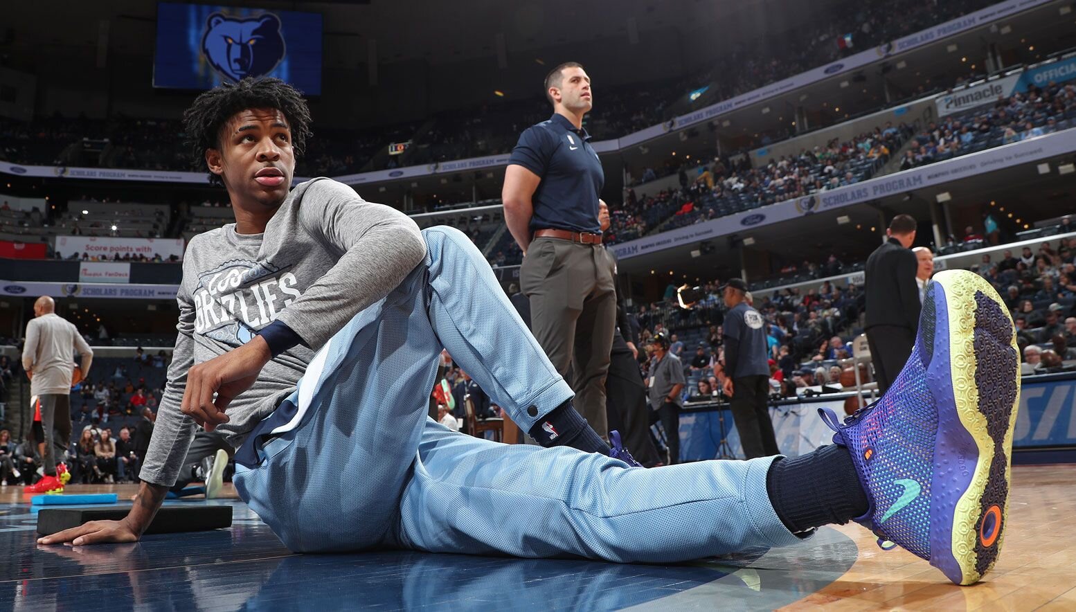 Ja Morant stretching during warmups