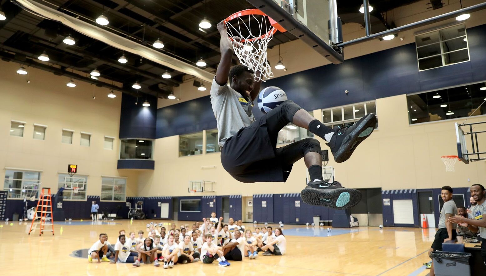 Sidy Sall dunking at a camp