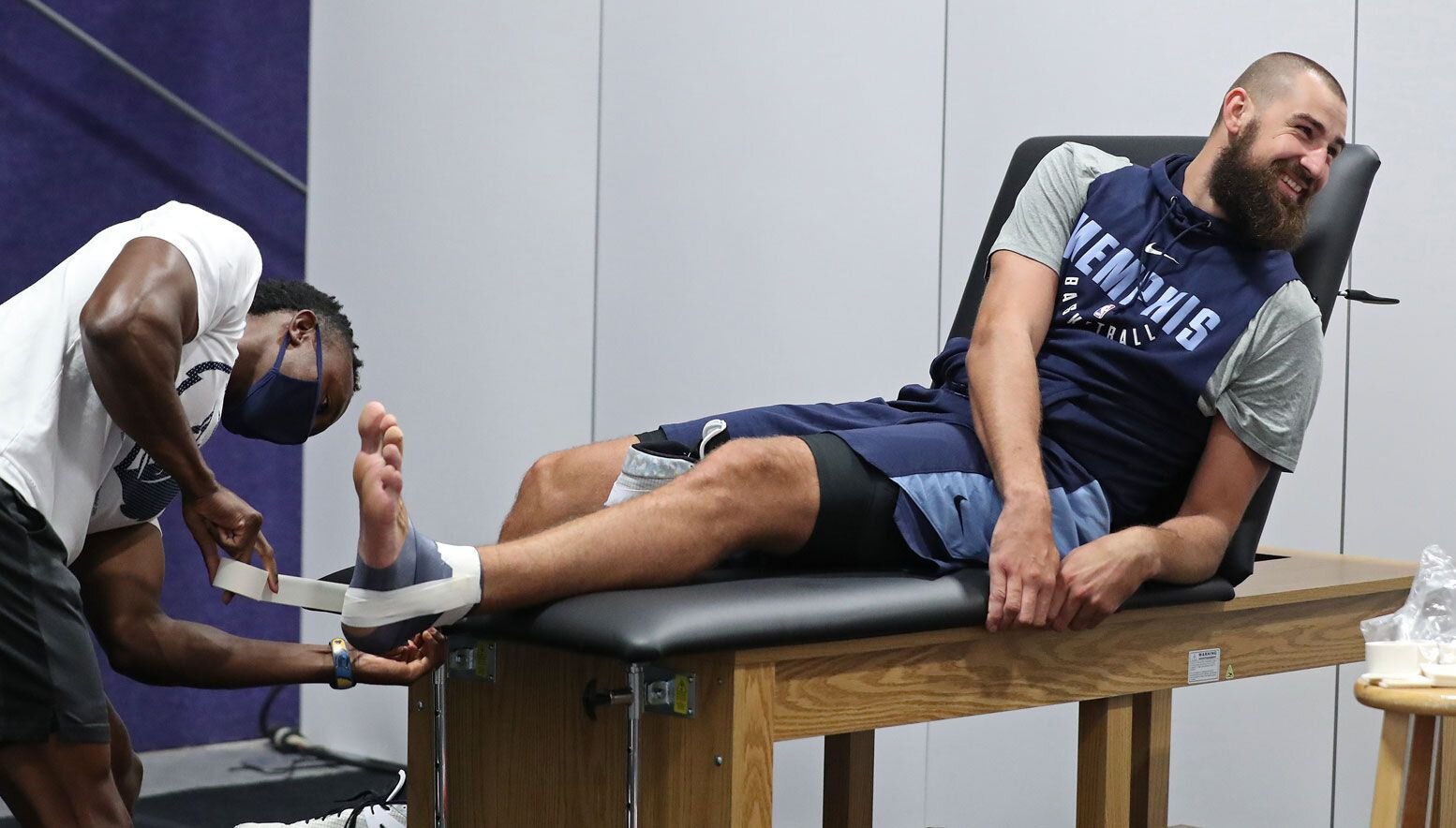 Jonas Valanciunas getting taped up during practice