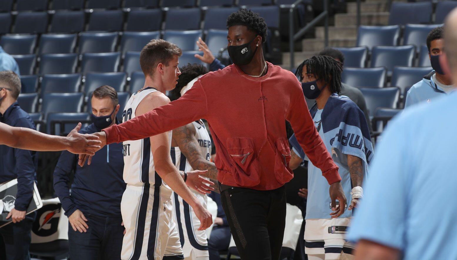 Jaren Jackson Jr. high-fives on the sideline