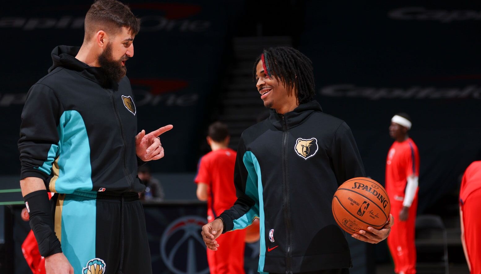 Jonas Valanciunas talking to Ja Morant