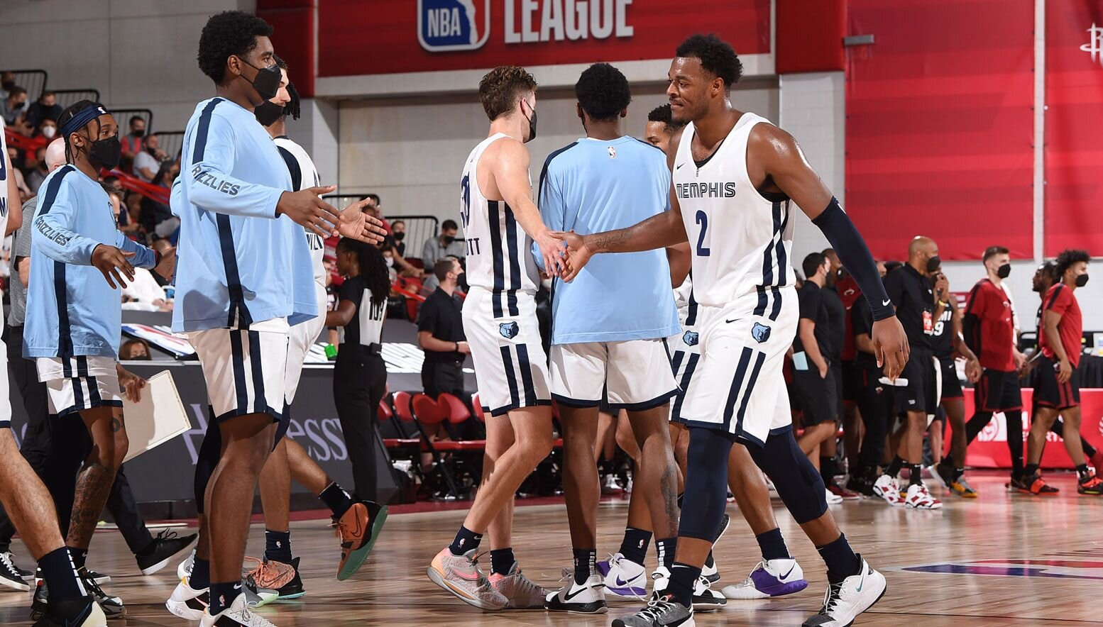 Xavier Tillman high fiving teammates