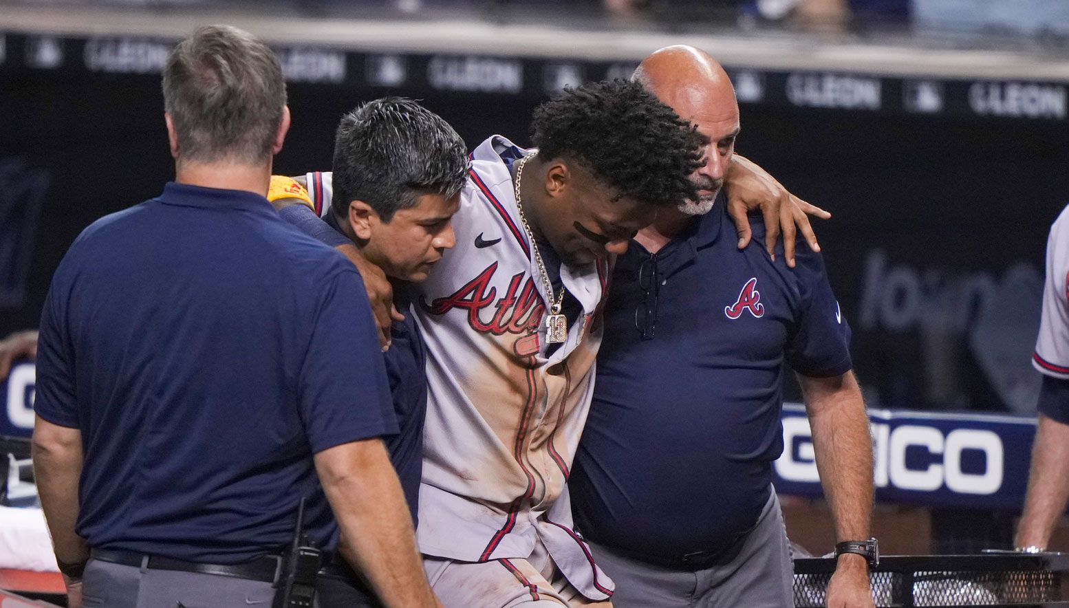 Ronald Acuna carried off the field from injury