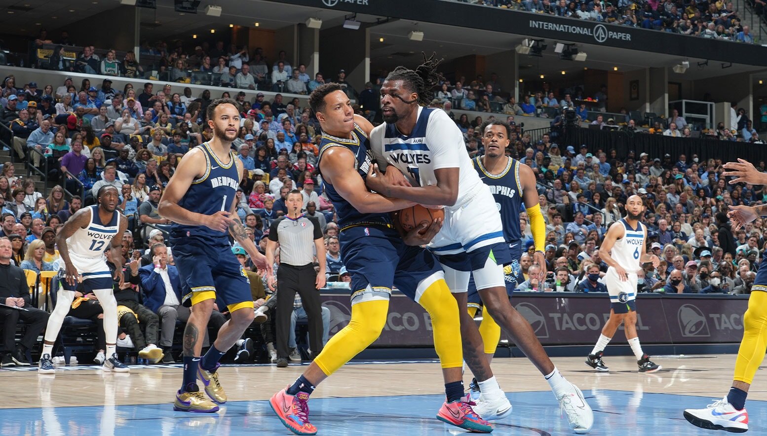 Desmond Bane #22 of the Memphis Grizzlies and Naz Reid #11 of the Minnesota Timberwolves fight for the ball