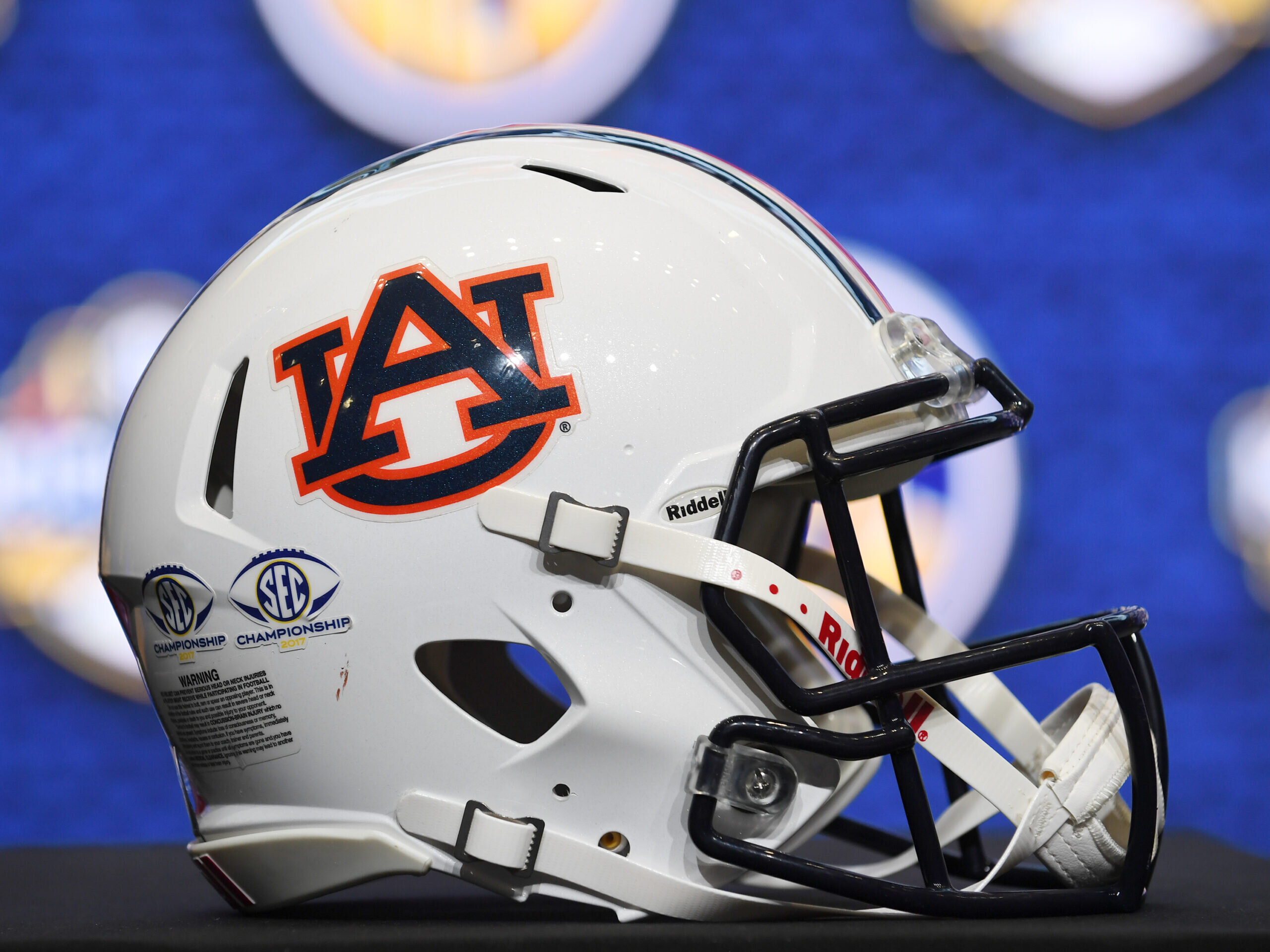 An Auburn Tigers football helmet sits on the podium class=