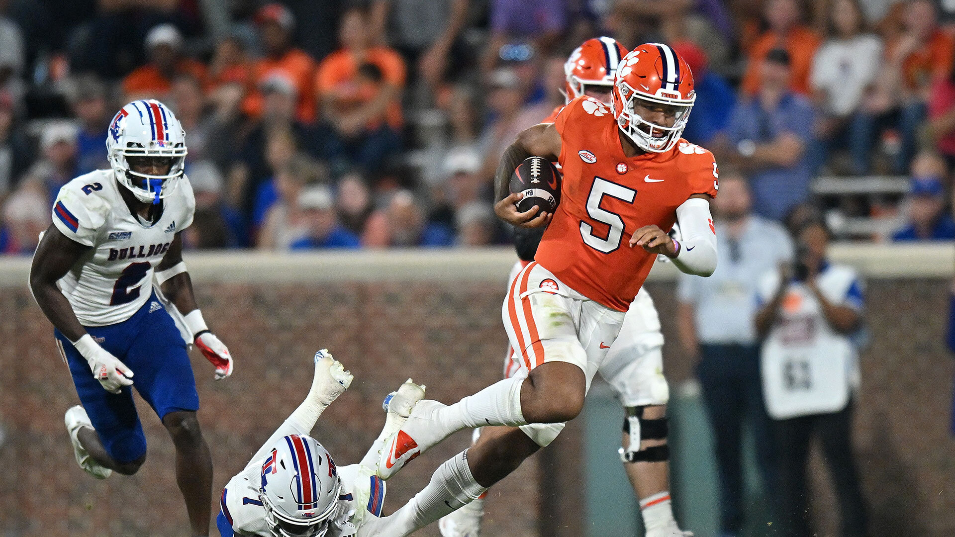 DJ Uiagalelei #5 of the Clemson Tigers scrambles Lduring their game at Memorial Stadium on September 17, 2022 in Clemson, South Carolina