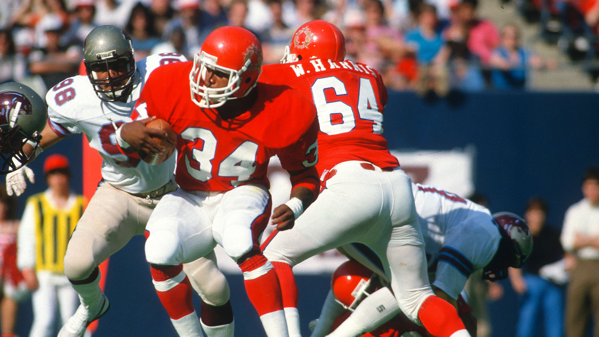 Running back Herschel Walker #34 of the New Jersey Generals carries the ball against the Birmingham Stallions circa 1983 during an USFL football game at The Meadowlands in East Rutherford, New Jersey