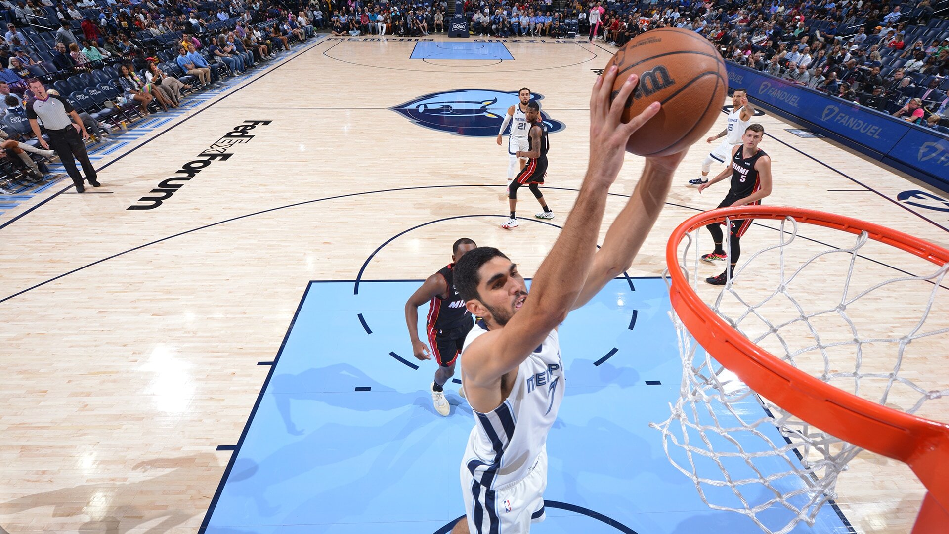 MEMPHIS, TN - OCTOBER 7: Santi Aldama #7 of the Memphis Grizzlies dunks the ball against the Miami Heat during a preseason game on October 7, 2022 at FedExForum in Memphis, Tennessee. Photo by Jesse D. Garrabrant/NBAE via Getty Images