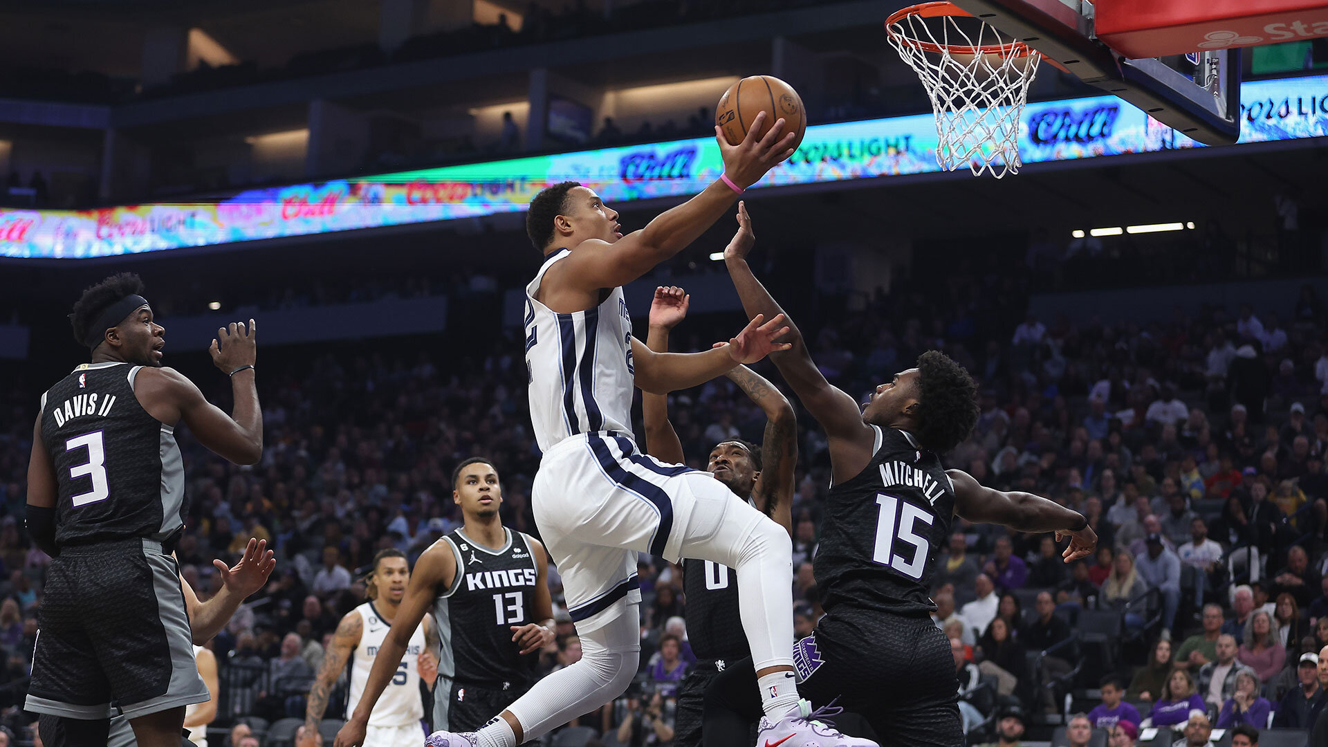 SACRAMENTO, CALIFORNIA - OCTOBER 27: Desmond Bane #22 of the Memphis Grizzlies goes to the basket against Davion Mitchell #15 of the Sacramento Kings in the first quarter at Golden 1 Center on October 27, 2022 in Sacramento, California. Photo by Lachlan Cunningham/Getty Images.