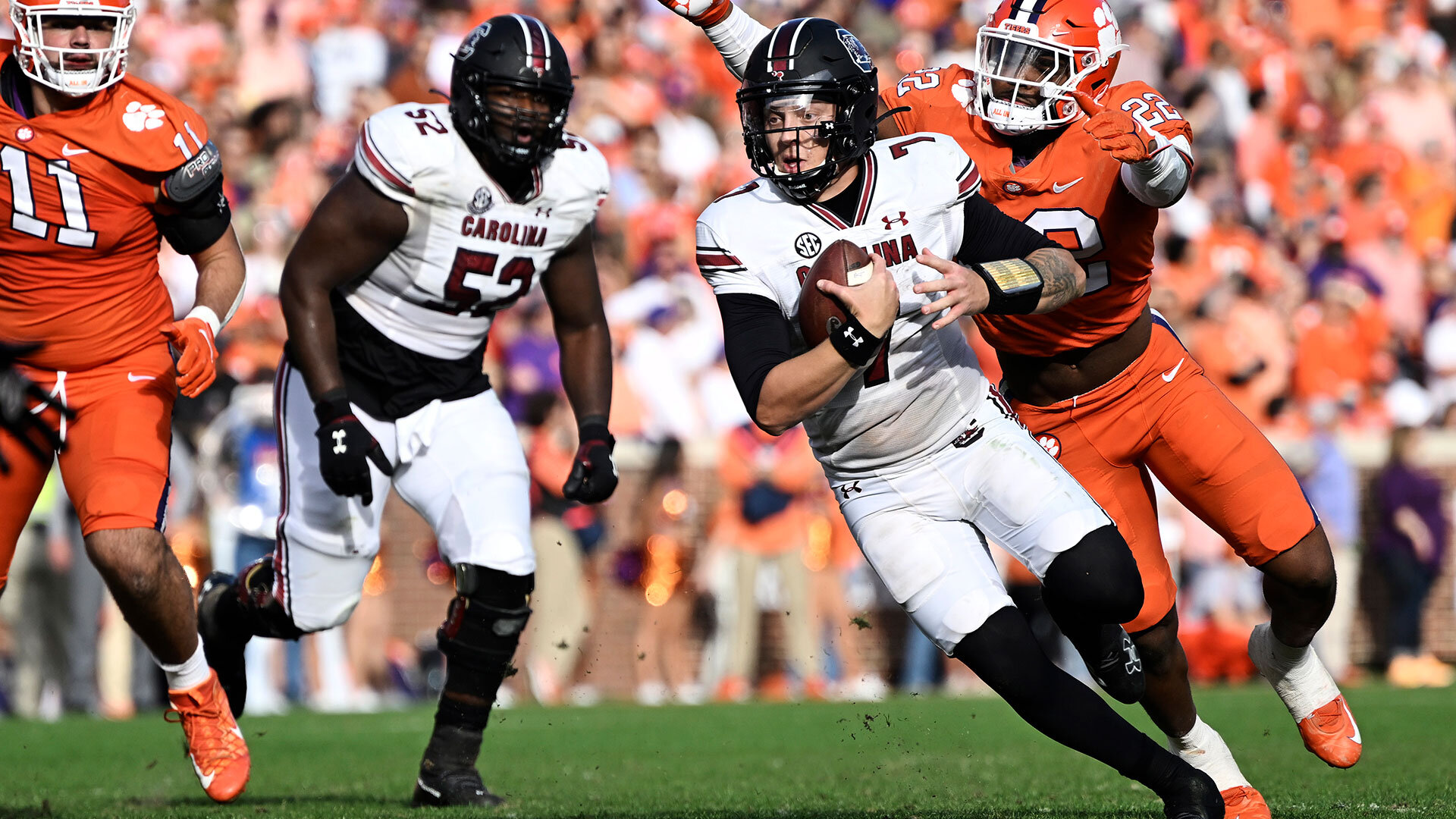 CLEMSON, SOUTH CAROLINA - NOVEMBER 26: Spencer Rattler #7 of the South Carolina Gamecocks gets tackled by Trenton Simpson #22 of the Clemson Tigers in the fourth quarter at Memorial Stadium on November 26, 2022 in Clemson, South Carolina. (Photo by Eakin Howard/Getty Images)