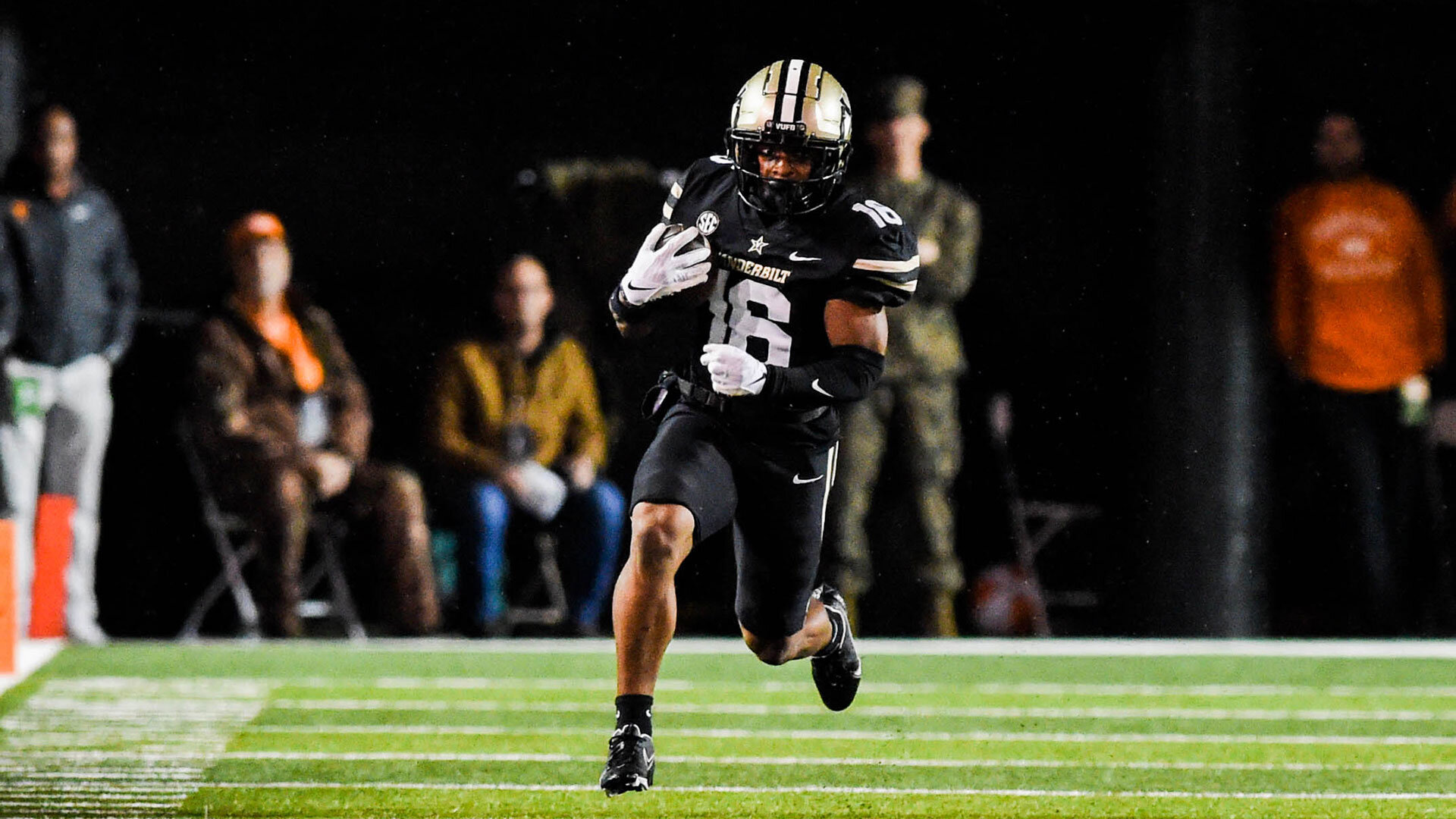 NASHVILLE, TENNESSEE - NOVEMBER 26: Jayden McGowan #16 of the Vanderbilt Commodores runs the ball in the first quarter against the Tennessee Volunteers at Vanderbilt Stadium on November 26, 2022 in Nashville, Tennessee. (Photo by Carly Mackler/Getty Images)