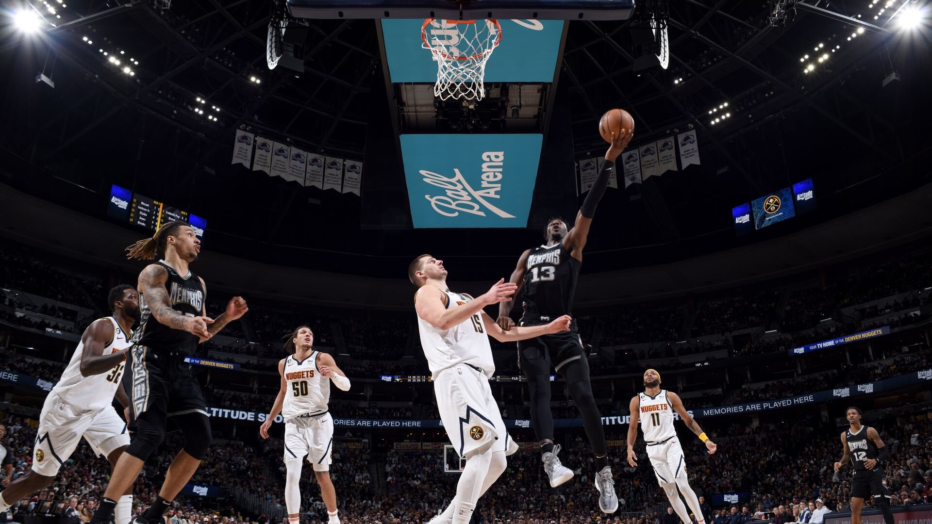 DENVER, CO - DECEMBER 20: Jaren Jackson Jr. #13 of the Memphis Grizzlies drives to the basket during the game against the Denver Nuggets on December 20, 2022 at the Ball Arena in Denver, Colorado.