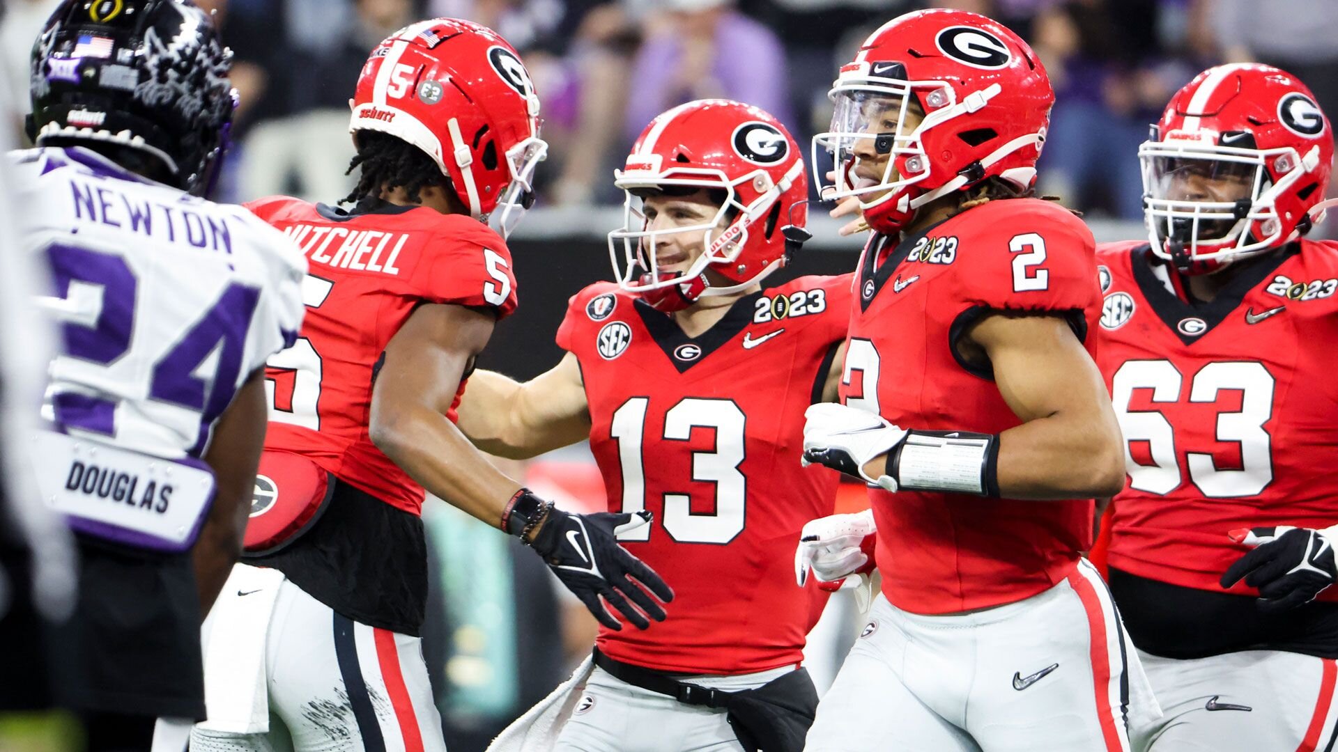 LOS ANGELES, CA - JANUARY 09: Georgia Bulldogs quarterback Stetson Bennett (13) celebrates with wide receiver Adonai Mitchell (5) after his touchdown run during the first half the CFP National Championship game against the TCU Horned Frogs at SoFi Stadium on Monday, Jan. 9, 2023 in Los Angeles, CA.(Robert Gauthier / Los Angeles Times via Getty Images)