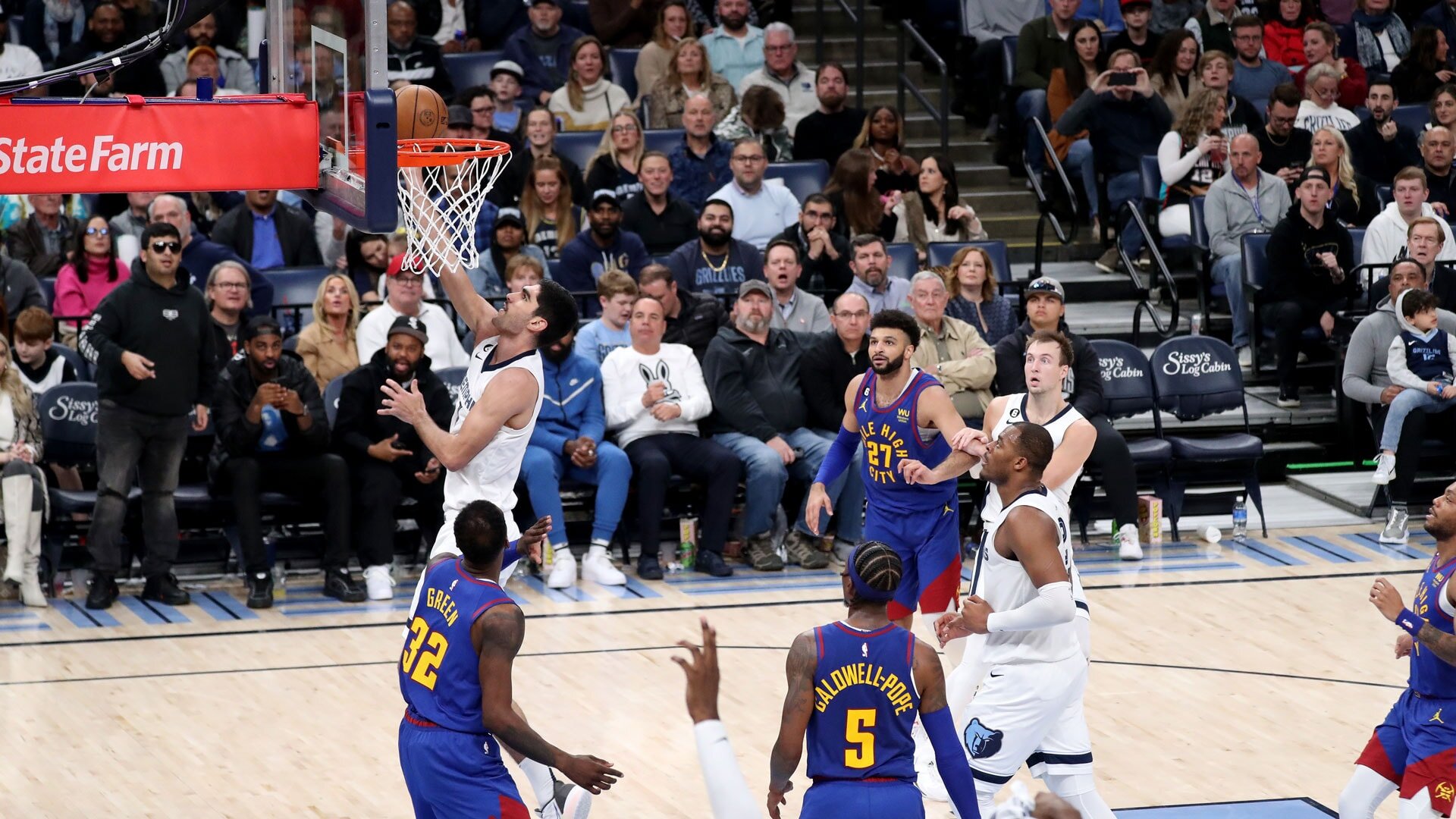 MEMPHIS, TN - FEBRUARY 25: Santi Aldama #7 of the Memphis Grizzlies drives to the basket against the Denver Nuggets on February 25, 2023 at FedExForum in Memphis, Tennessee.