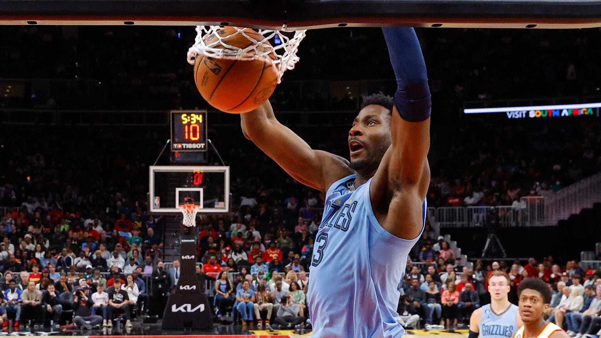 ATLANTA, GA - MARCH 26: Jaren Jackson Jr. #13 of the Memphis Grizzlies dunks during the first half against the Atlanta Hawks at State Farm Arena on March 26, 2023 in Atlanta, Georgia.