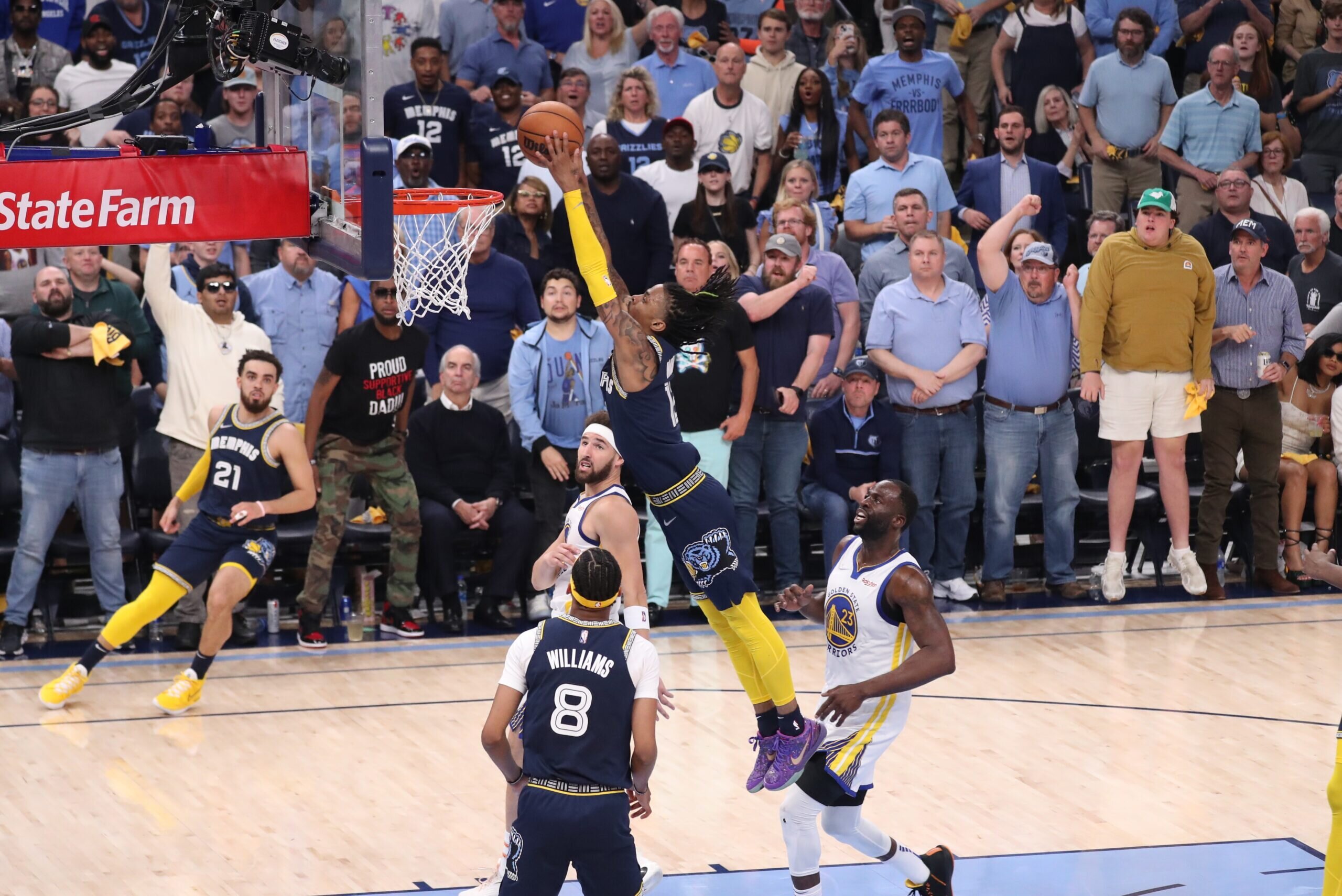 MEMPHIS, TN - MAY 3: Ja Morant #12 of the Memphis Grizzlies dunks the ball against the Golden State Warriors during Game 2 of the 2022 NBA Playoffs Western Conference Semifinals on May 3, 2022 at FedExForum in Memphis, Tennessee.