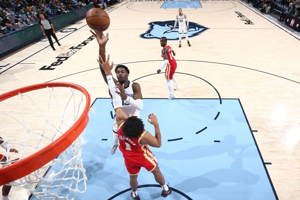 MEMPHIS, TN - DECEMBER 12: Jaren Jackson Jr. #13 of the Memphis Grizzlies shoots the ball during the game against the Atlanta Hawks on December 12, 2022 at FedExForum in Memphis, Tennessee. NOTE TO USER: User expressly acknowledges and agrees that, by downloading and or using this photograph, User is consenting to the terms and conditions of the Getty Images License Agreement. Mandatory Copyright Notice: Copyright 2022 NBAE (Photo by Joe Murphy/NBAE via Getty Images)