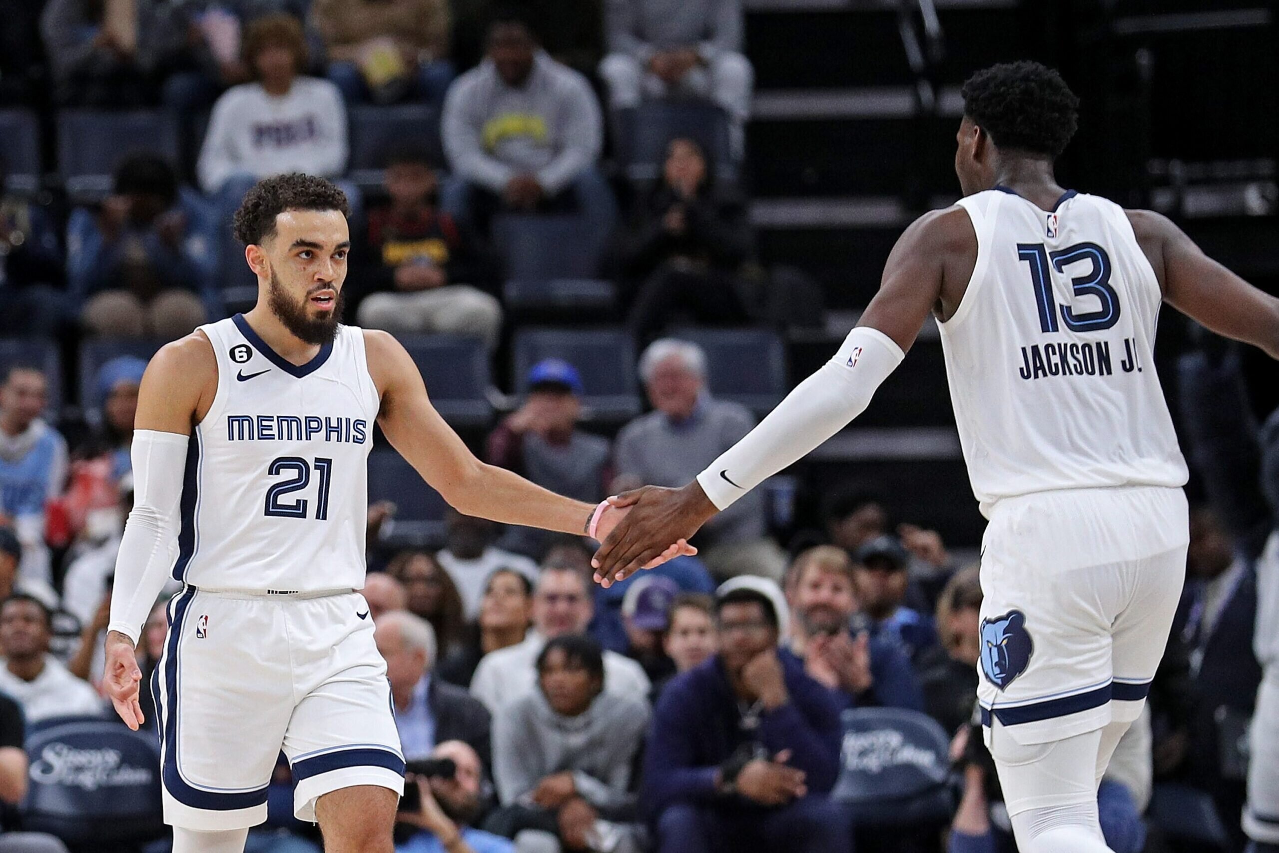 MEMPHIS, TENNESSEE - DECEMBER 12: Tyus Jones #21 and Jaren Jackson Jr. #13 of the Memphis Grizzlies during the first half against the Atlanta Hawks at FedExForum on December 12, 2022 in Memphis, Tennessee. NOTE TO USER: User expressly acknowledges and agrees that, by downloading and or using this photograph, User is consenting to the terms and conditions of the Getty Images License Agreement. (Photo by Justin Ford/Getty Images)