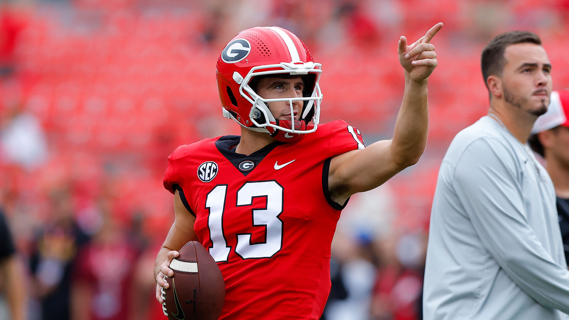 Stetson Bennett #13 of the Georgia Bulldogs warms up prior to the game against the Samford Bulldogs