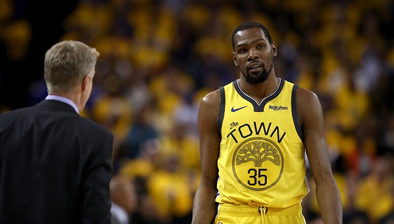 Kevin durant heads toward Steve Kerr