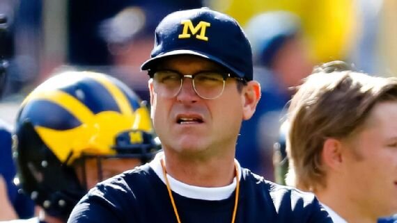 Jim Harbaugh wearing glasses