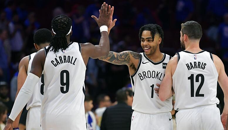  D'Angelo Russell #1 of the Brooklyn Nets celebrates with teammates