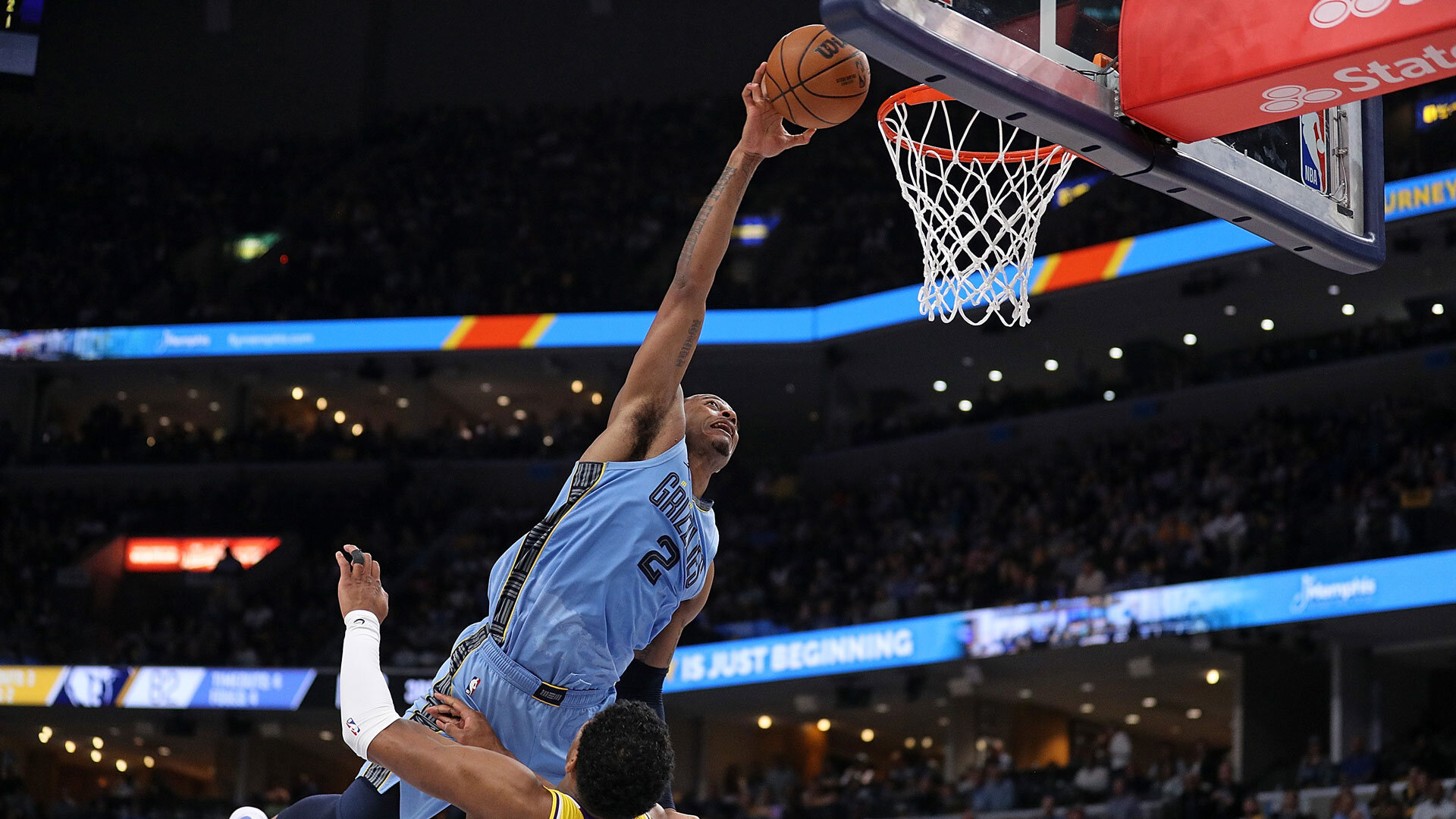 MEMPHIS, TENNESSEE - APRIL 26: Xavier Tillman #2 of the Memphis Grizzlies goes to the basket against Rui Hachimura #28 of the Los Angeles Lakers during the second half of Game Five of the Western Conference First Round Playoffs at FedExForum on April 26, 2023 in Memphis, Tennessee.