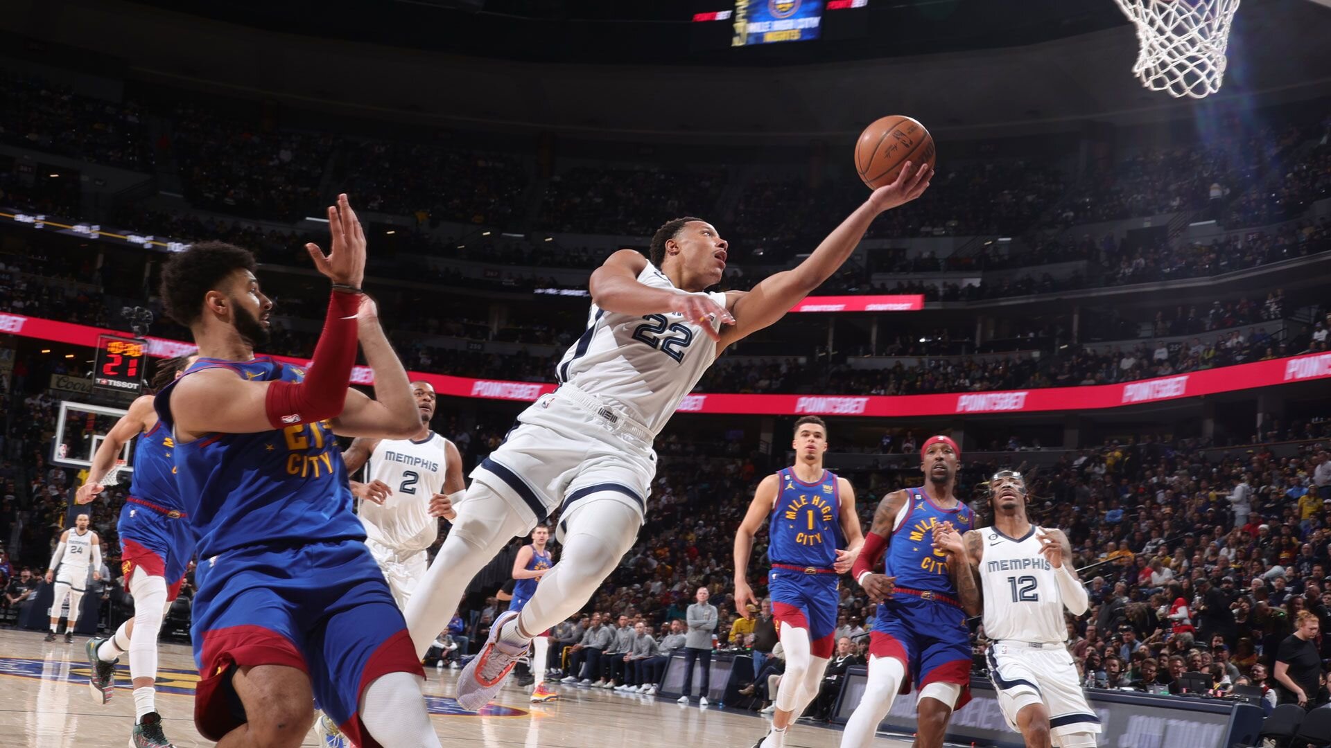 DENVER, CO - MARCH 3: Desmond Bane #22 of the Memphis Grizzlies drives to the basket during the game against the Denver Nuggets on March 3, 2023 at the Ball Arena in Denver, Colorado.