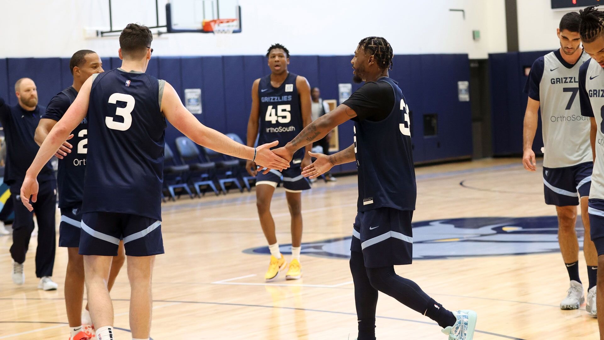 MEMPHIS, TN - OCTOBER 3: Jake LaRavia #3 and Marcus Smart #36 of the Memphis Grizzlies high five during a team practice on October 3, 2023 at FedExForum in Memphis, Tennessee.