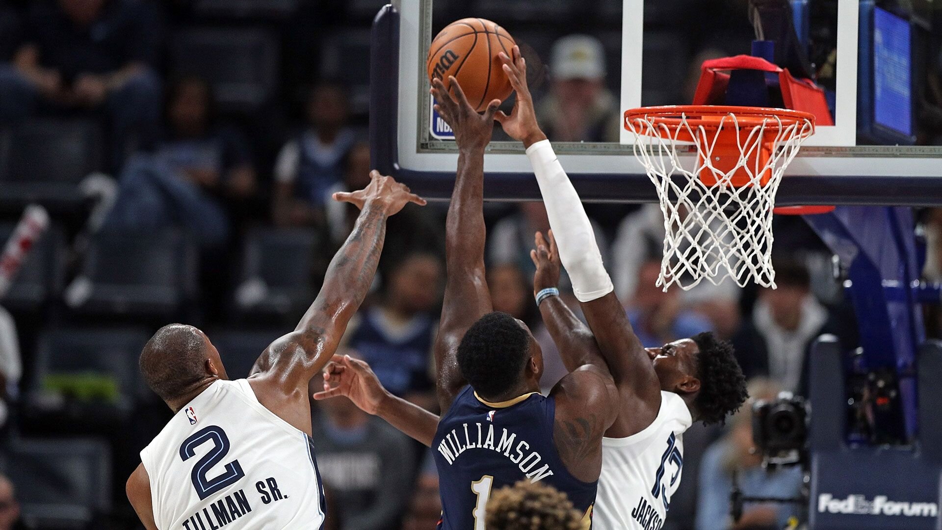 MEMPHIS, TENNESSEE - OCTOBER 25: Jaren Jackson Jr. #13 of the Memphis Grizzlies blocks the shot of Zion Williamson #1 of the New Orleans Pelicans during the first half at FedExForum on October 25, 2023 in Memphis, Tennessee.