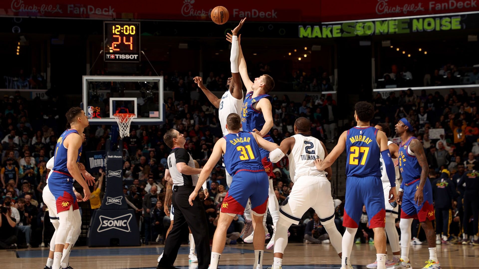 MEMPHIS, TN - FEBRUARY 25: Nikola Jokic #15 of the Denver Nuggets and Jaren Jackson Jr. #13 of the Memphis Grizzlies goes for the opening tip off between the Denver Nuggets and the Memphis Grizzlies on February 25, 2023 at FedExForum in Memphis, Tennessee.