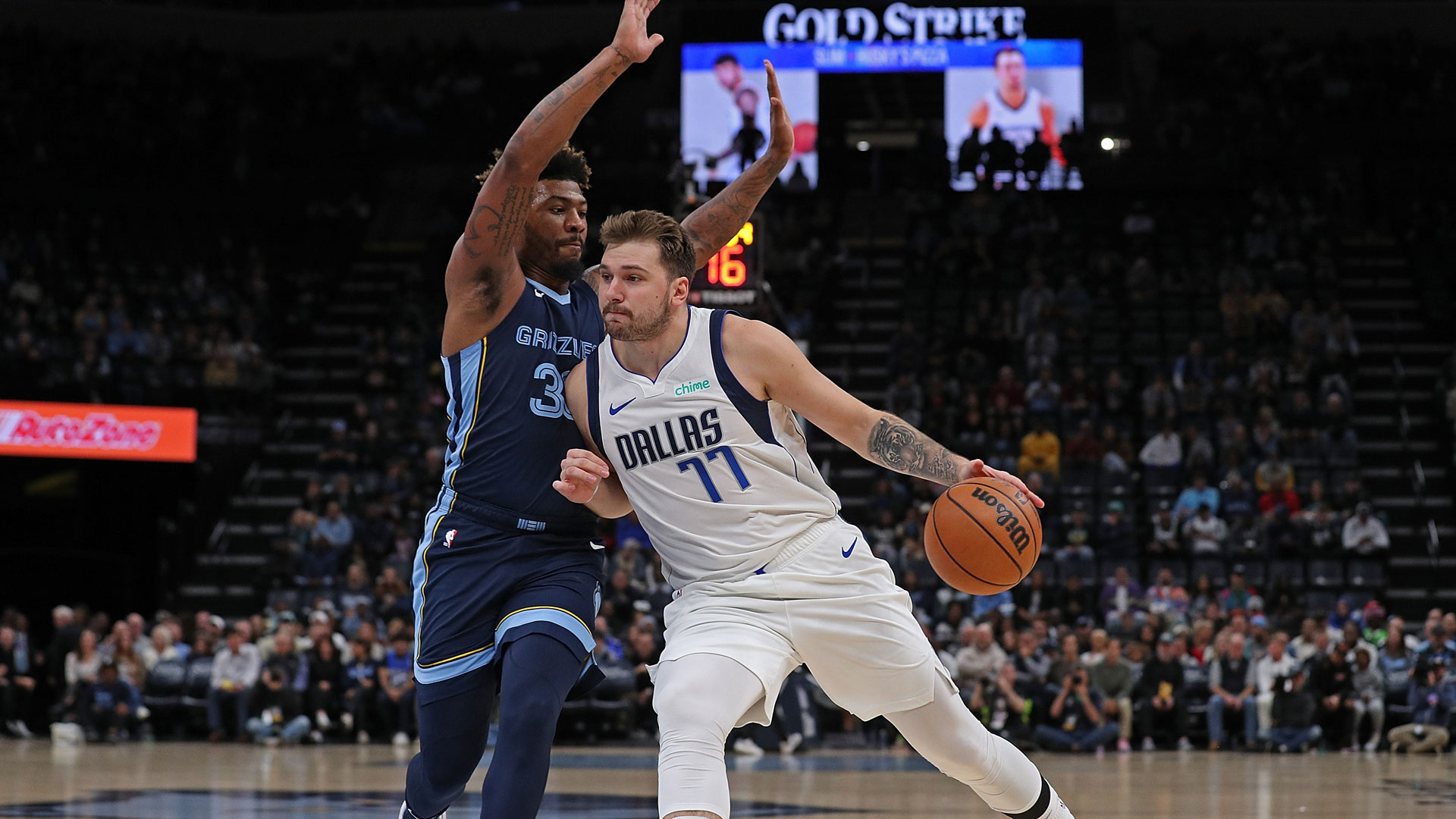 MEMPHIS, TENNESSEE - OCTOBER 30: Luka Doncic #77 of the Dallas Mavericks goes to the basket against Marcus Smart #36 of the Memphis Grizzlies during the first half at FedExForum on October 30, 2023 in Memphis, Tennessee.