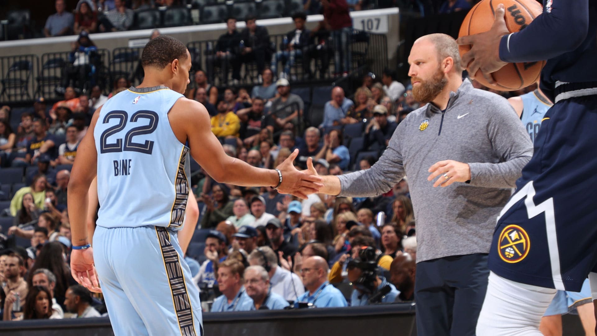 MEMPHIS, TN - OCTOBER 27: Desmond Bane #22 and Head Coach Taylor Jenkins of the Memphis Grizzlies high five during the game against the Denver Nuggets on October 27, 2023 at FedExForum in Memphis, Tennessee.