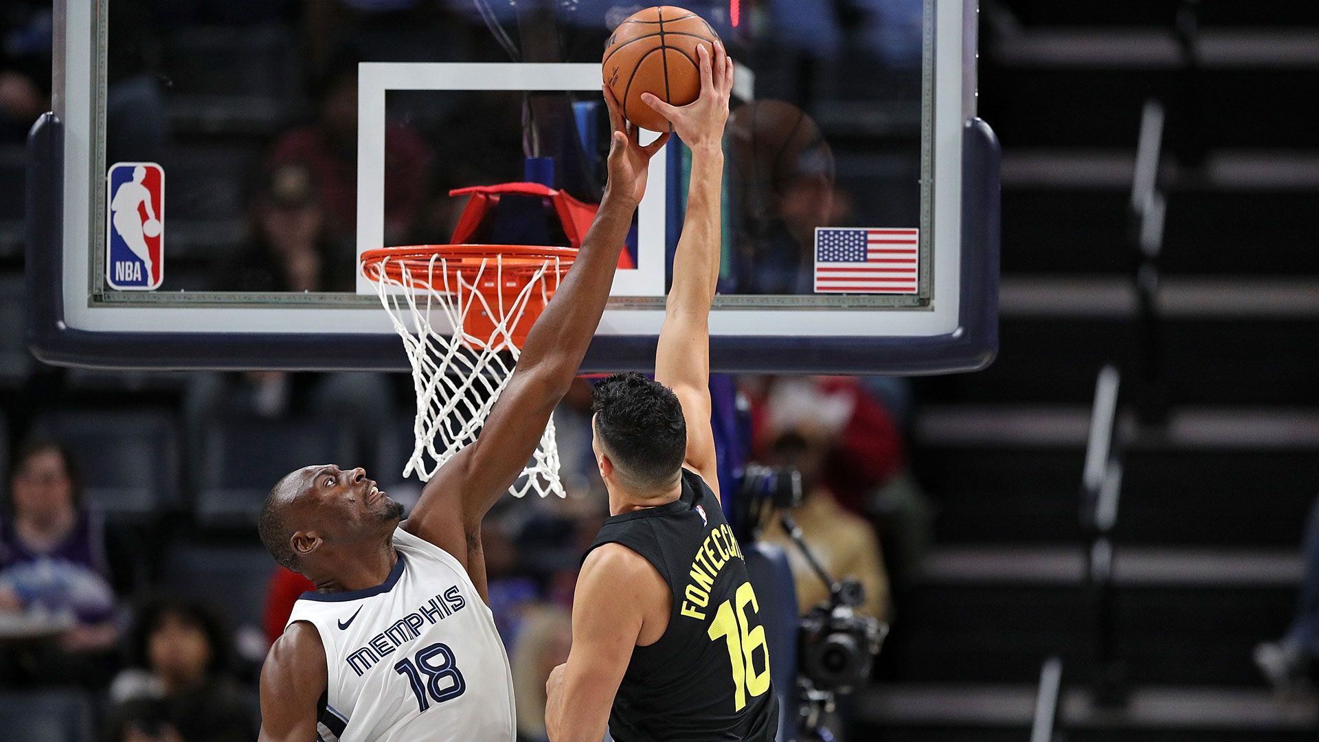 MEMPHIS, TENNESSEE - NOVEMBER 29: Bismack Biyombo #18 of the Memphis Grizzlies blocks the shot of Simone Fontecchio #16 of the Utah Jazz during the first half at FedExForum on November 29, 2023 in Memphis, Tennessee.