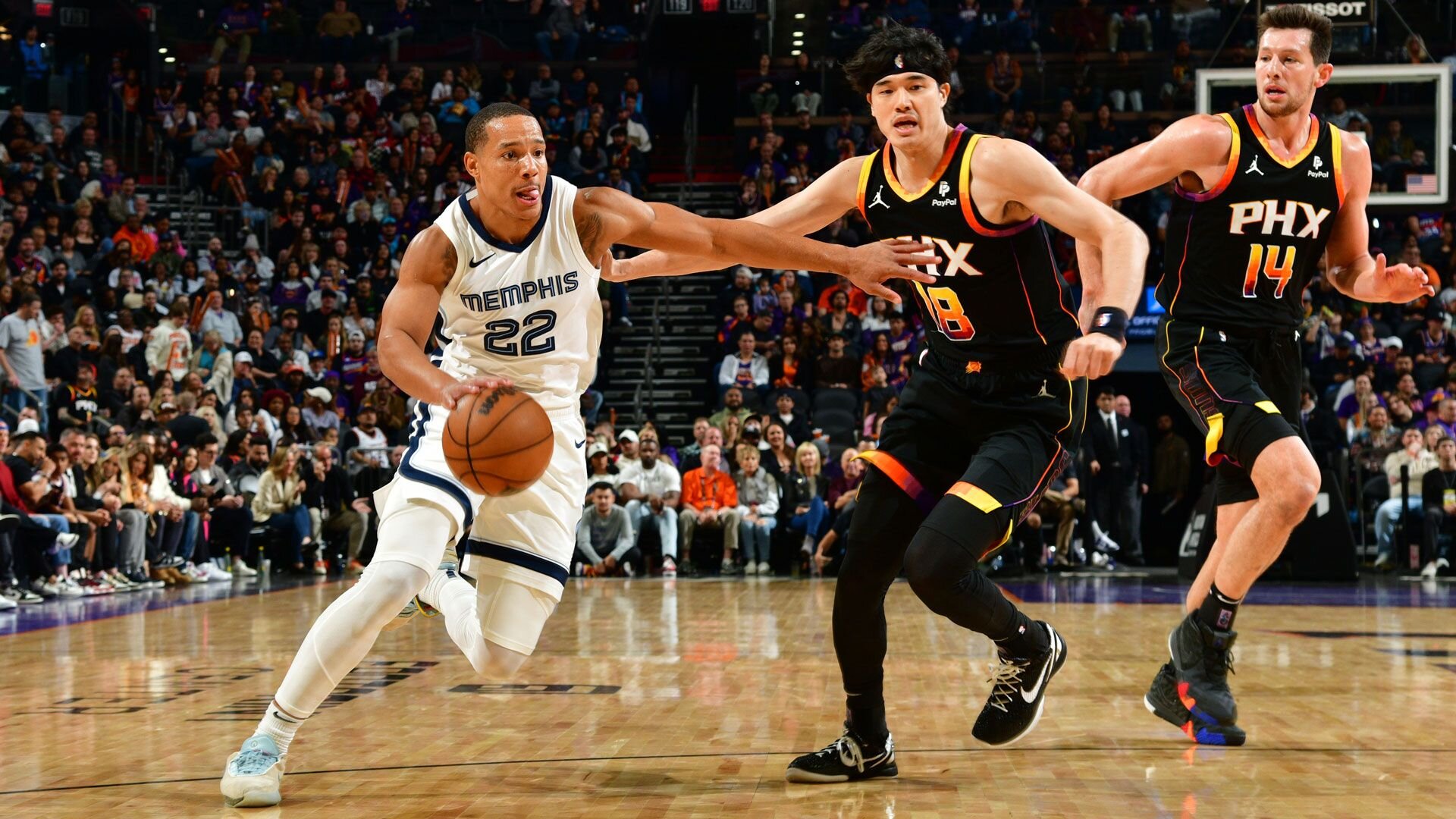 PHOENIX, AZ - DECEMBER 2: Desmond Bane #22 of the Memphis Grizzlies drives to the basket during the game against the Phoenix Suns on December 2, 2023 at Footprint Center in Phoenix, Arizona.