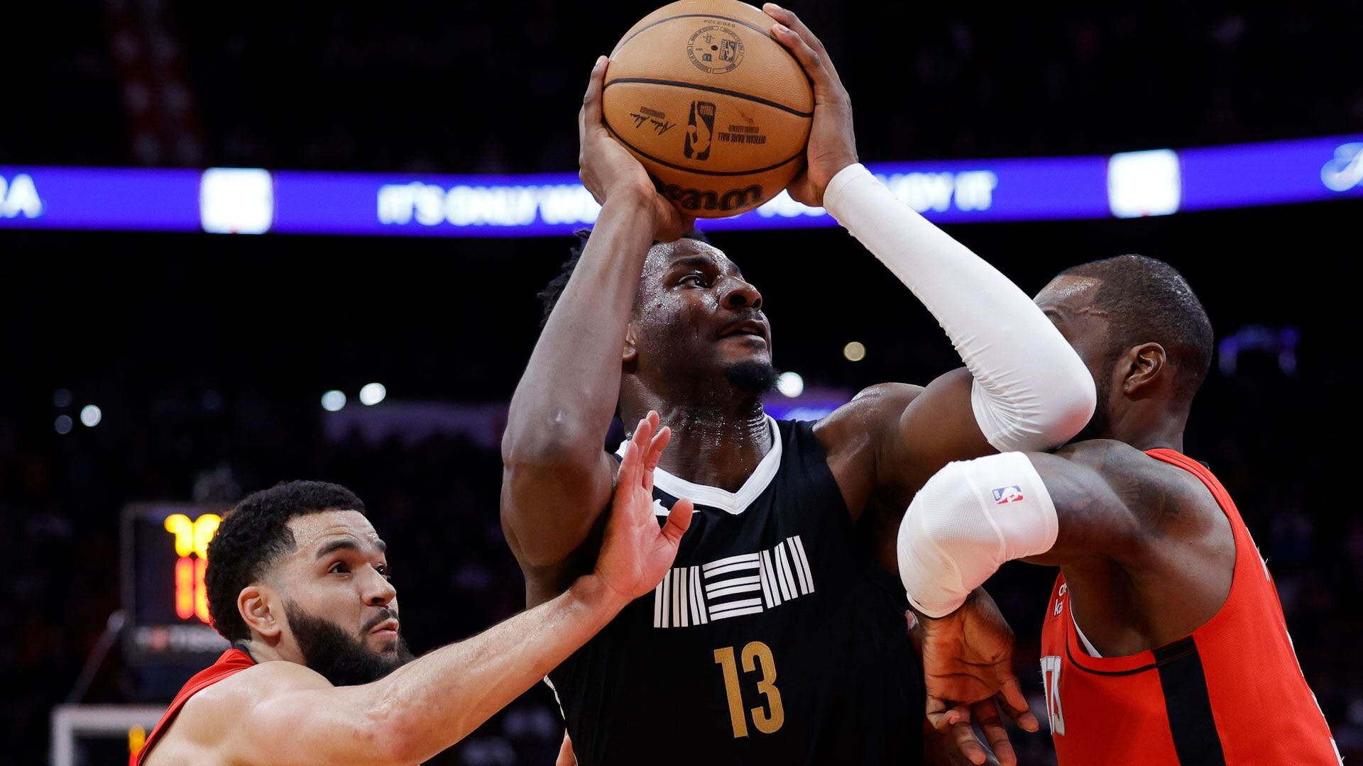 HOUSTON, TEXAS - DECEMBER 13: Jaren Jackson Jr. #13 of the Memphis Grizzlies drives against Jeff Green #32 of the Houston Rockets during the second half at Toyota Center on December 13, 2023 in Houston, Texas.