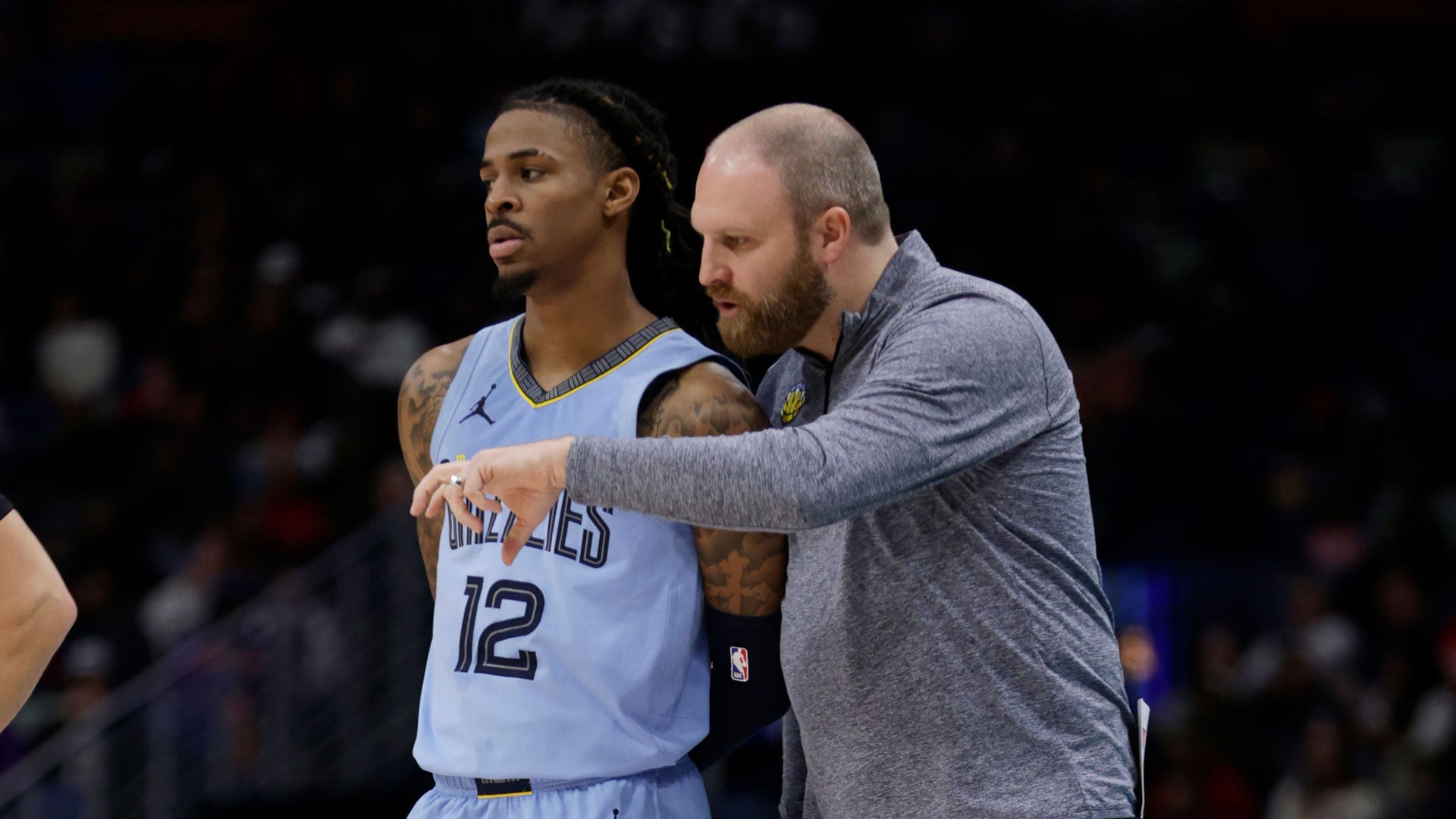 NEW ORLEANS, LA - DECEMBER 26: Head Coach Taylor Jenkins of the Memphis Grizzlies talks with Ja Morant #12 during the game against the New Orleans Pelicans on December 26, 2023 at the Smoothie King Center in New Orleans, Louisiana.