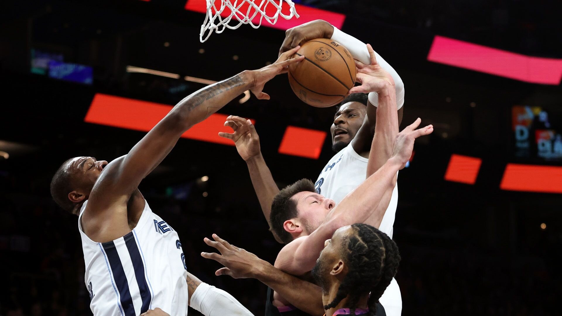 PHOENIX, ARIZONA - DECEMBER 02: Jaren Jackson Jr. #13 of the Memphis Grizzlies makes a block against Drew Eubanks #14 of the Phoenix Suns during the first quarter at Footprint Center on December 02, 2023 in Phoenix, Arizona.