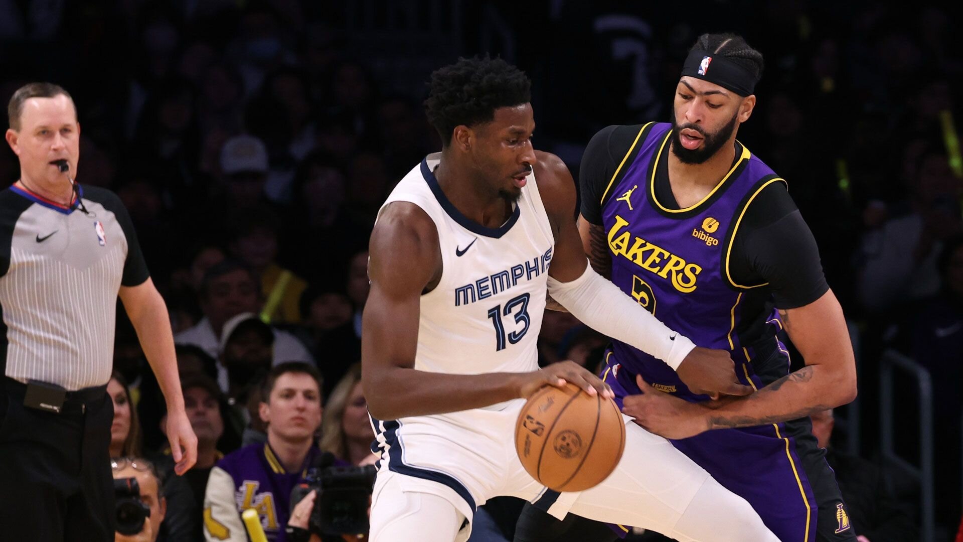 LOS ANGELES, CALIFORNIA - JANUARY 05: Jaren Jackson Jr. #13 of the Memphis Grizzlies posts up Anthony Davis #3 of the Los Angeles Lakers during a 127-113 Grizzlies win at Crypto.com Arena on January 05, 2024 in Los Angeles, California.