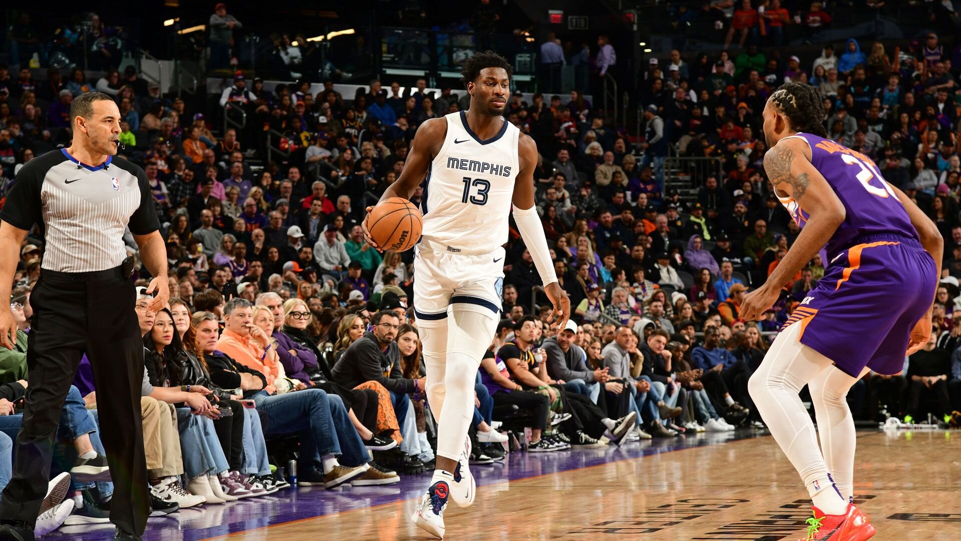 PHOENIX, AZ - JANUARY  7: Jaren Jackson Jr. #13 of the Memphis Grizzlies dribbles the ball during the game against the Phoenix Suns on January 7, 2024 at Footprint Center in Phoenix, Arizona.