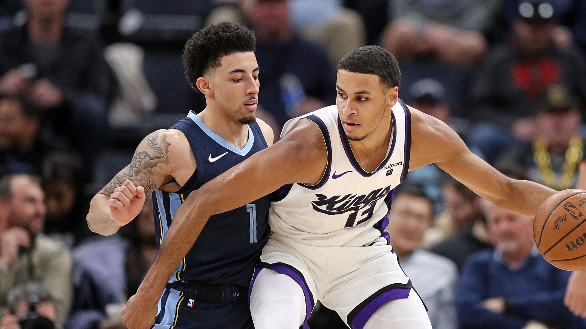MEMPHIS, TENNESSEE - JANUARY 29: Scotty Pippen Jr. #1 of the Memphis Grizzlies defends against  Keegan Murray #13 of the Sacramento Kings during the second half at FedExForum on January 29, 2024 in Memphis, Tennessee.