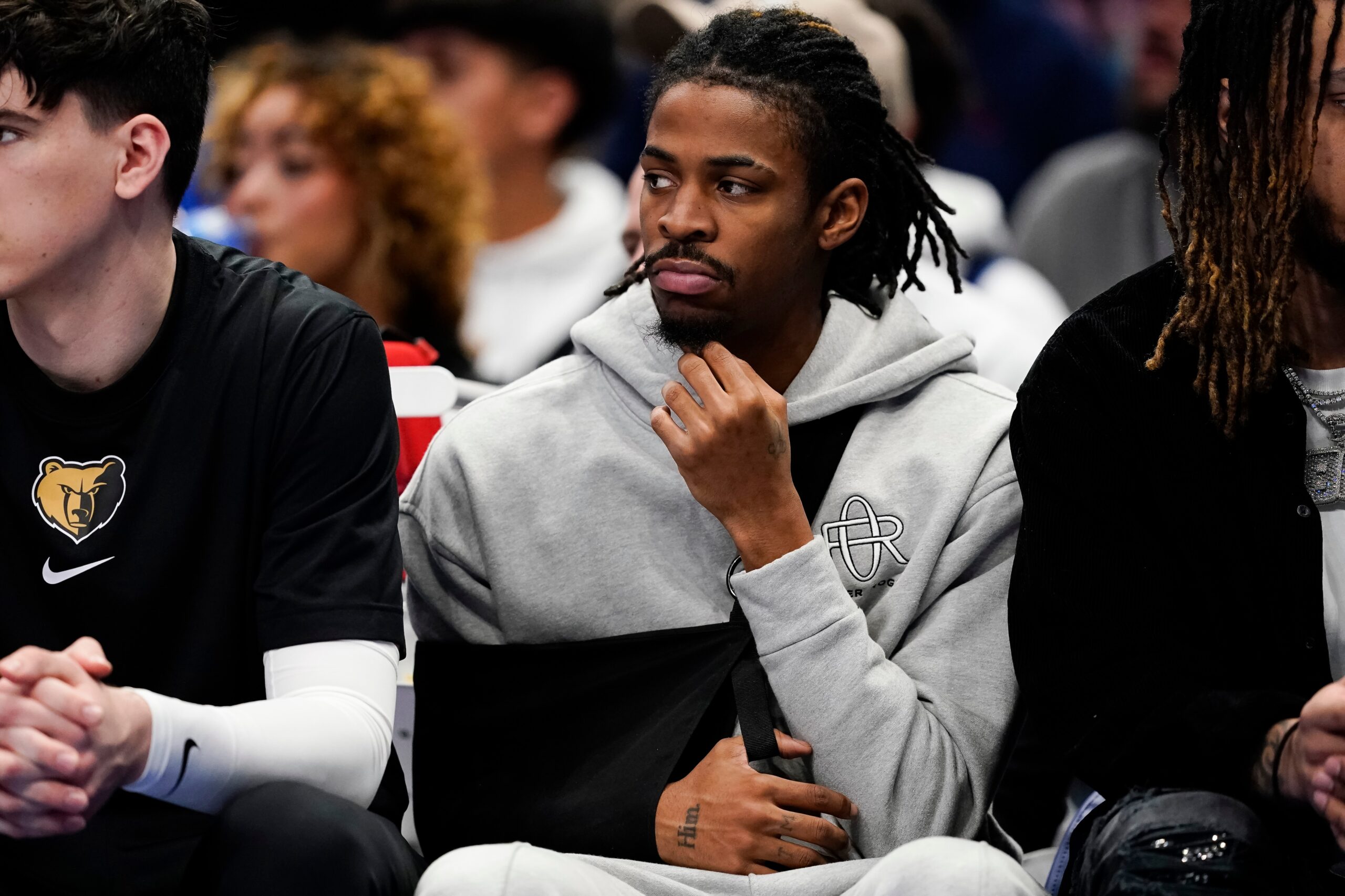 DALLAS, TEXAS - JANUARY 09:  Ja Morant #12 of the Memphis Grizzlies watches play from the bench during the first half against the Dallas Mavericks at American Airlines Center on January 09, 2024 in Dallas, Texas. NOTE TO USER: User expressly acknowledges and agrees that, by downloading and or using this photograph, User is consenting to the terms and conditions of the Getty Images License Agreement. (Photo by Sam Hodde/Getty Images)